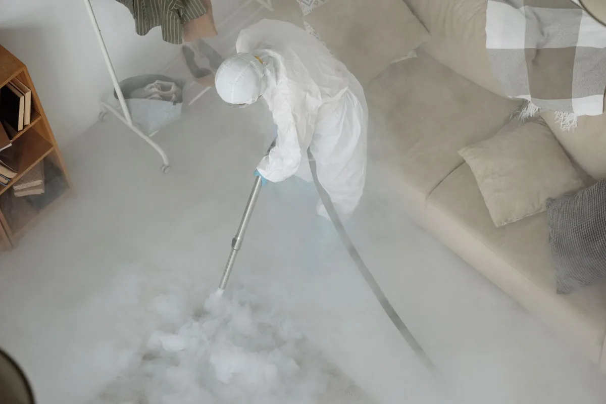 Biohazard cleanup technician in protective equipment, Sunnyside, GA